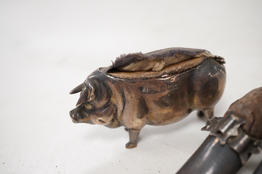 Five assorted novelty silver pin cushions, to include a model pig, maker's mark rubbed, Birmingham, 1903, length 67mm, two model shoes by Adie & Lovekin, a small elephant by Saunders & Shepherd, Birmingham, 1905 and a ti